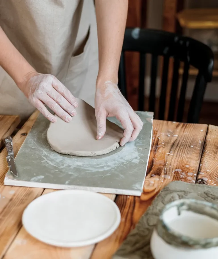 creative-woman-making-clay-pot-her-workshop